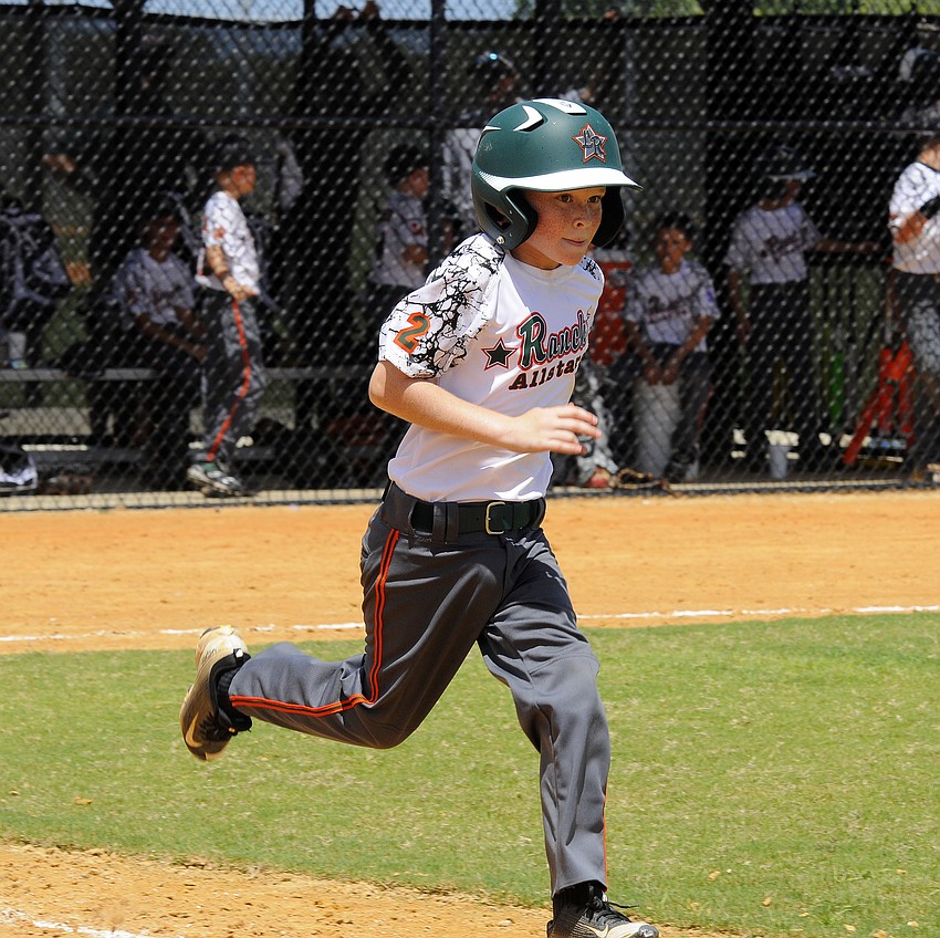 Lakewood Ranch Little League 9/10 All-Star Jonathan Stone races down the first base line after making contact.