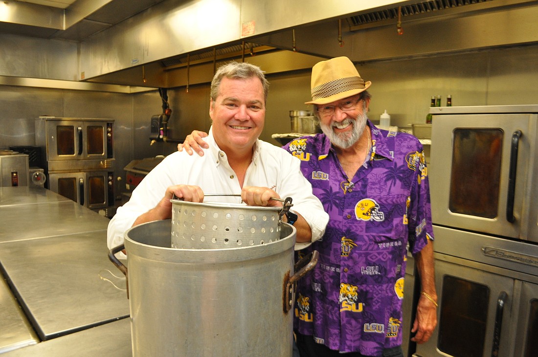 Polo Grill and Bar owner Tommy Klauber and relative Spyder Broussard, who grew up in Houma, La., outside New Orleans.