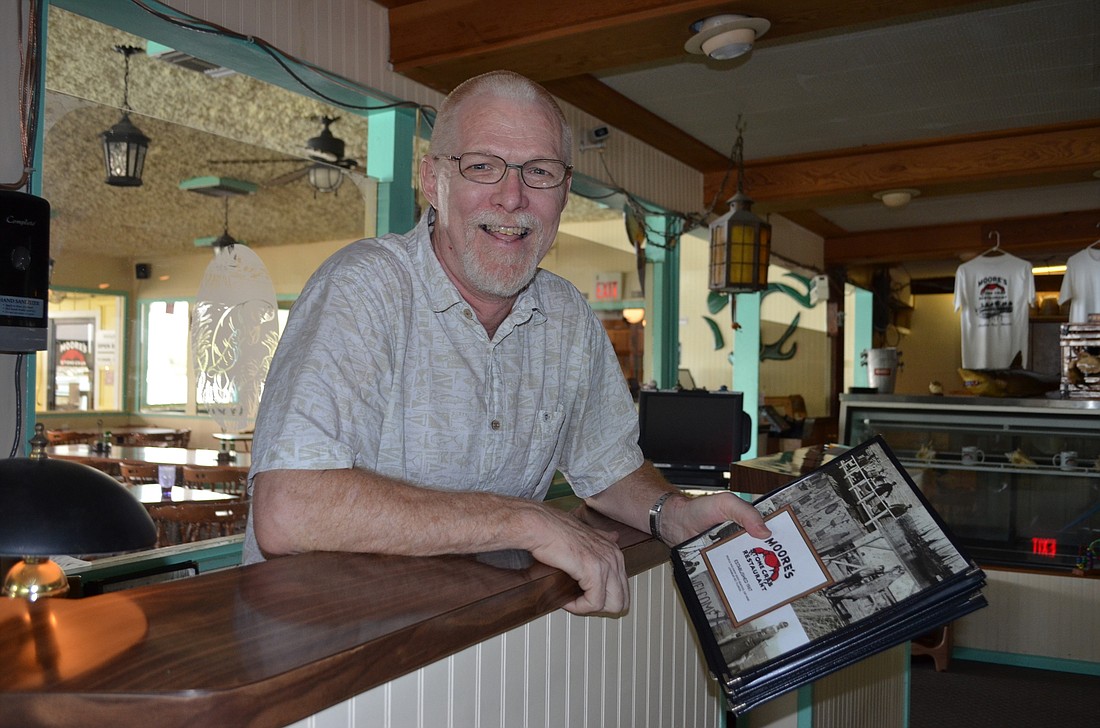 Mooreâ€™s Stone Crab Restaurant co-owner Alan Moore's longest job at his restaurant was the face patrons saw as they entered the door with menus in hand ready to take them to their tables.
