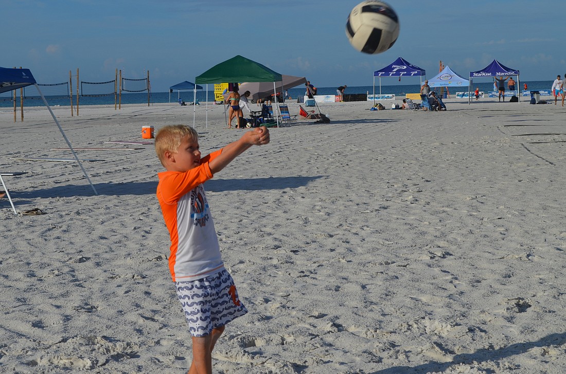 Cade Strom warms up for the 2014 Dig the Beach Volleyball Tournament on Siesta Key Beach.