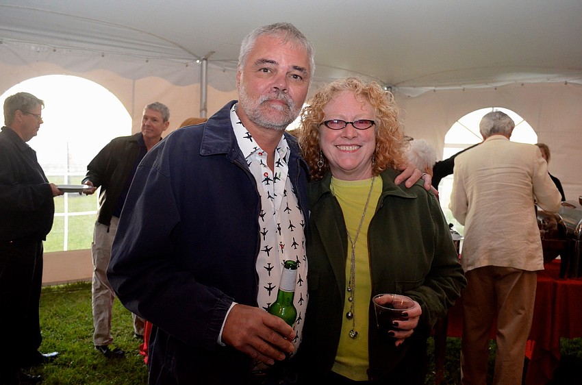 Urban Green and Sheila Foley try to stay warm during the outdoor event.