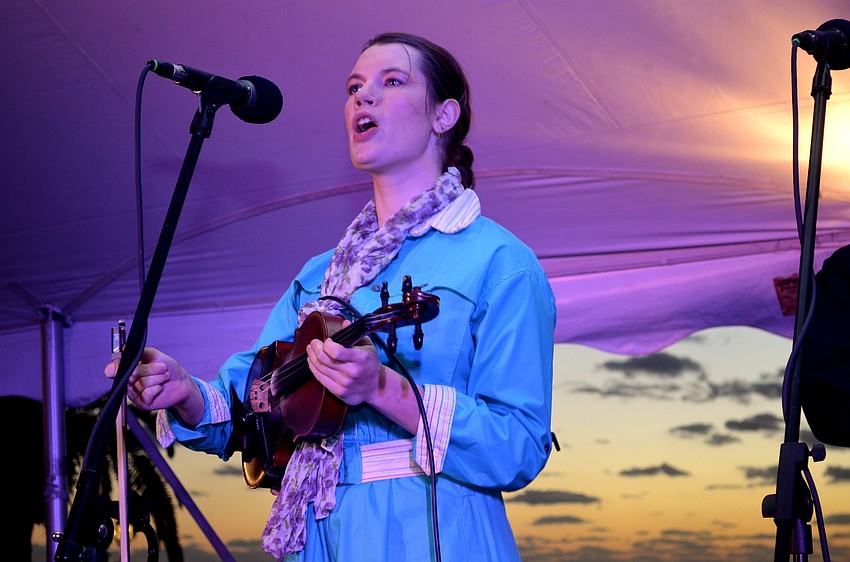 Sara Moone plays the violin and sings during the live performance.