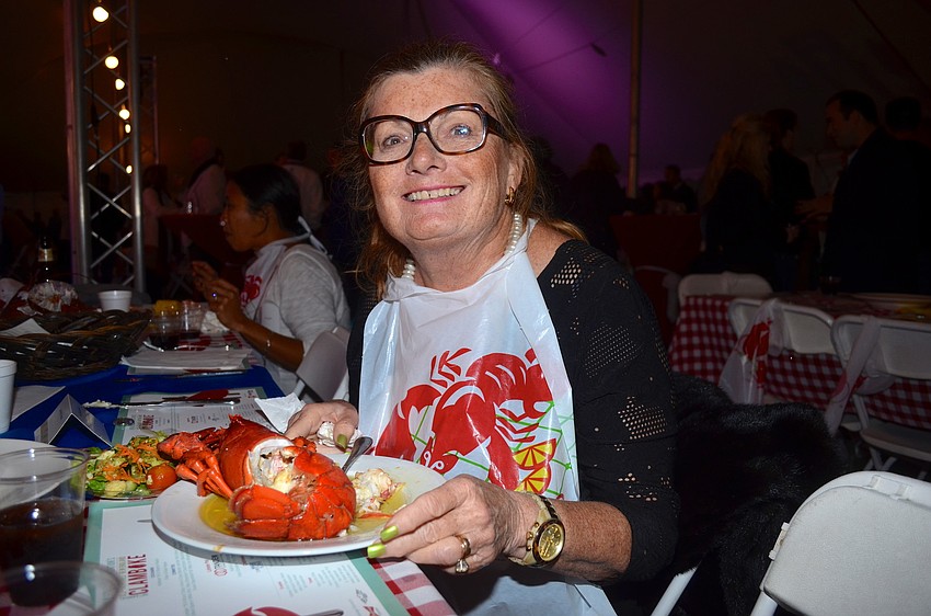 Jane Nutter-Johnson enjoys a plate full of seafood.