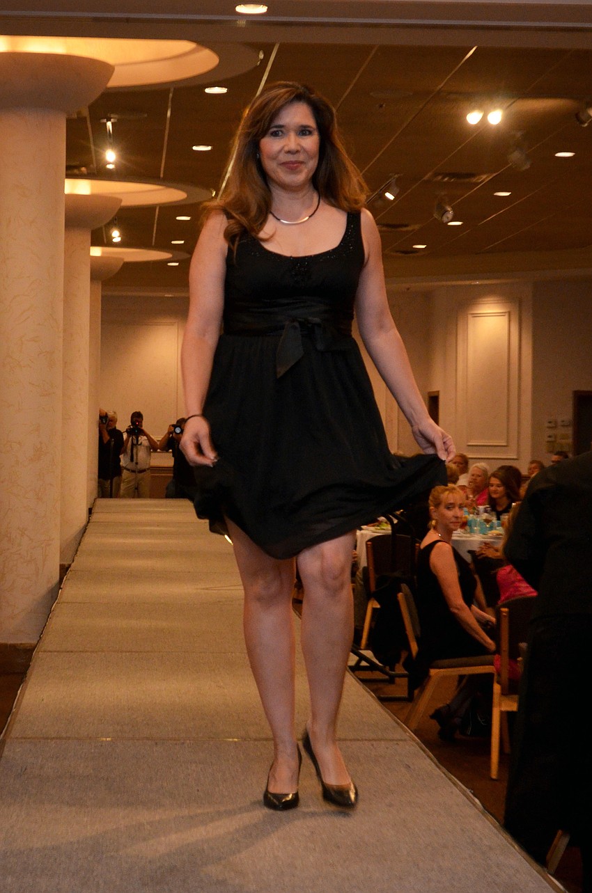 Local media women model in the Little Black Dress fashion show