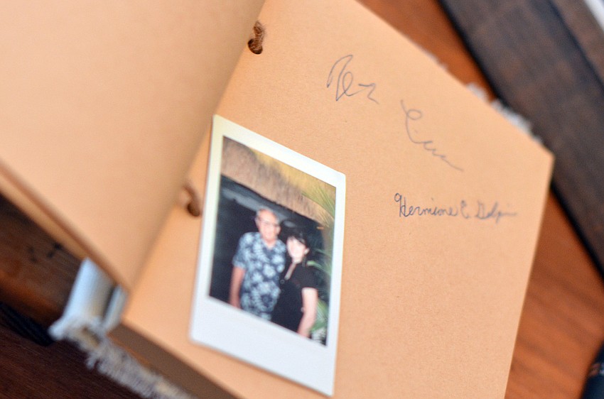 Guests signed and took a Polaroid picture to be included in the guest book for honorees Warren and Margot Coville at Starry Night Dinner I.