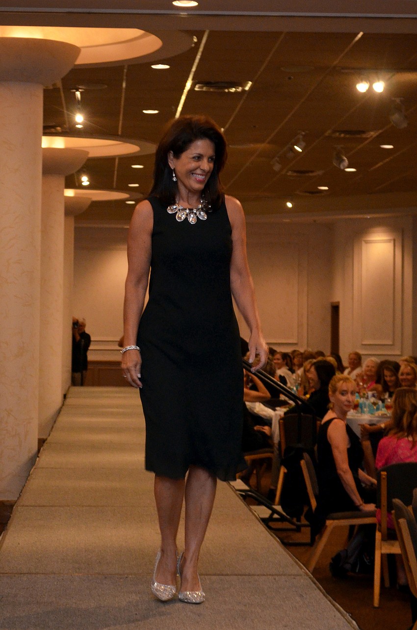 Local media women model in the Little Black Dress fashion show