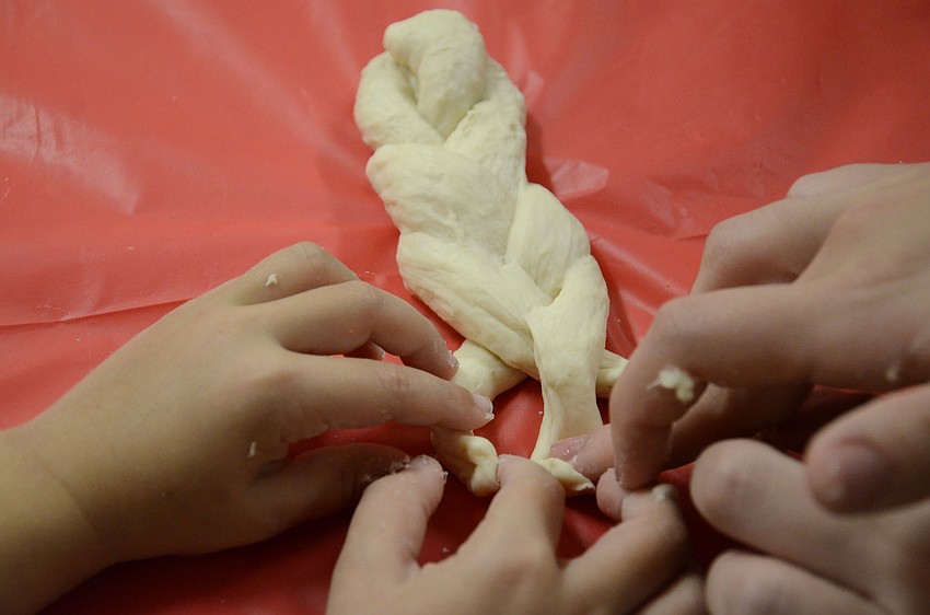 Challah bread is distinguished by its braided pattern.