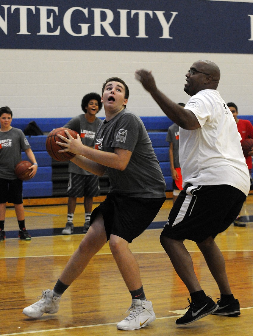 Sarasota Military Academy sophomore Garrett Gill goes up for a shot.