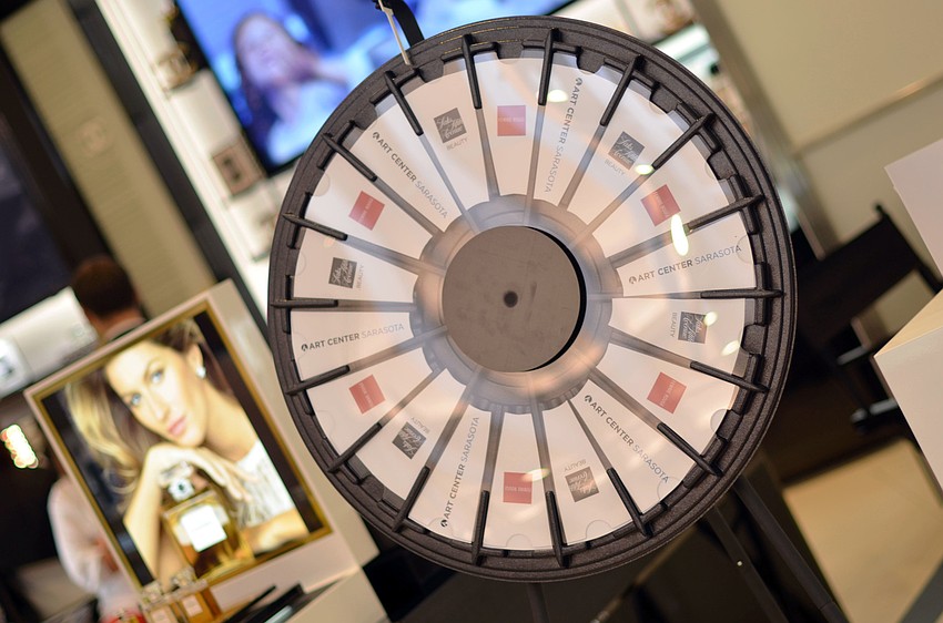 Guests spun the wheel at Saks Fifth Avenue during the Brushes with Greatness event for a chance to win great prizes.