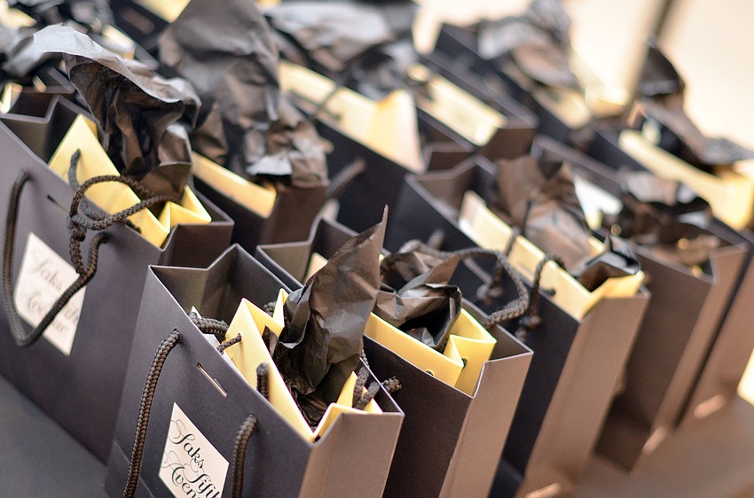 Guests received swag bags from Saks Fifth Avenue at the Brushes with Greatness event benefiting Art Center Sarasota Friday, Nov. 7.