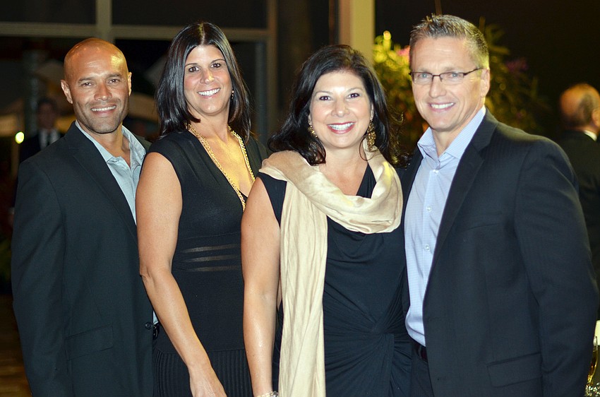 Giovanni and Julie DeCastro with Renee and Tom Brady