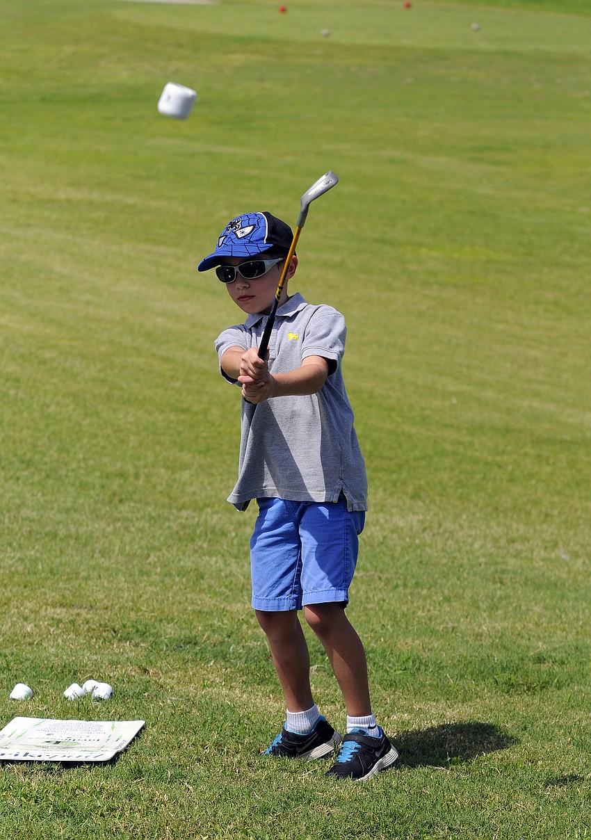 Seven-year-old Alek Sarantopoulos enjoyed pitching because he got to hit birdie balls into the sky.
