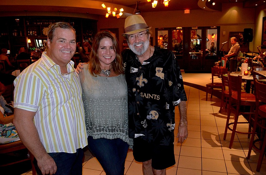 Tommy and Jaymie Klauber enjoy a moment with Spyder Broussard, after whom the event was named.