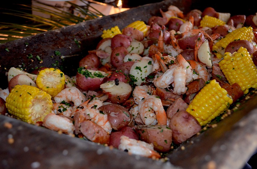 Spiced shrimp, potatoes, corn on the cob were one of various dinner choices.