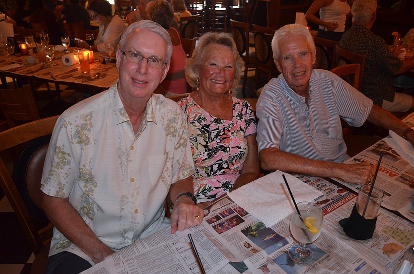 Dick Butler enjoys dinner and drinks with friends Robin and Harry Zechman.