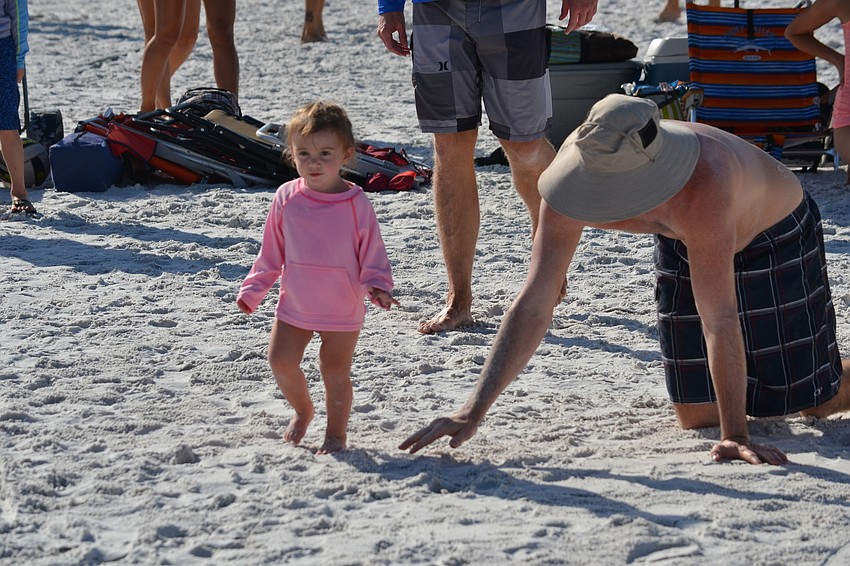 Ryan Wilder chases after his daughter Wren.