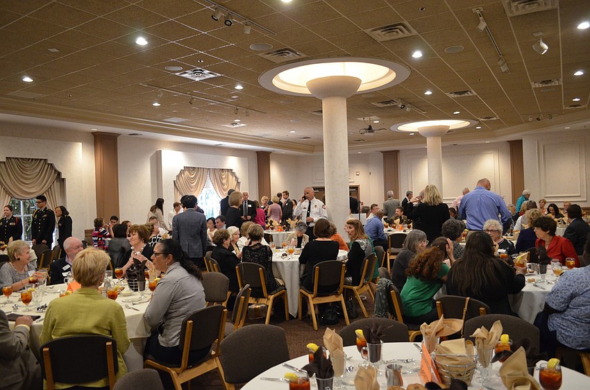 Guests mingle before sitting down to start the Sarasota Tiger Bay Club Luncheon March 5 at Michael’s On East.