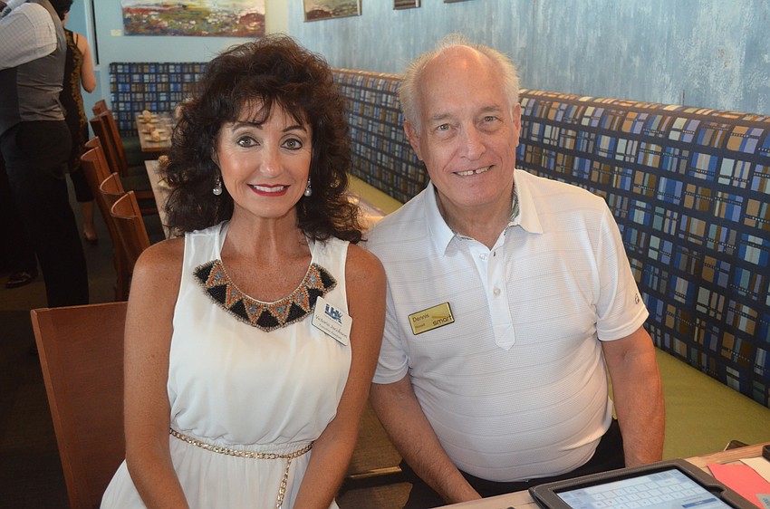 Chamber Executive Assistant Victoria Jacobson and Dennis Hassell, of Smart Merchandise Services