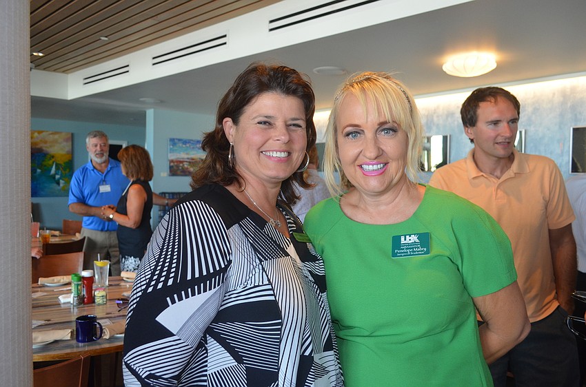 Susanne Stovall, of ICORR Properties International, and Penelope Mabrey, of SERVPRO of Bradenton