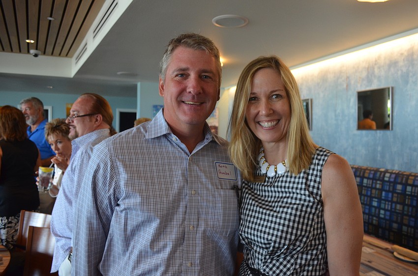 Keith Goebel and Sherri Mills, of Michael Saunders & Company