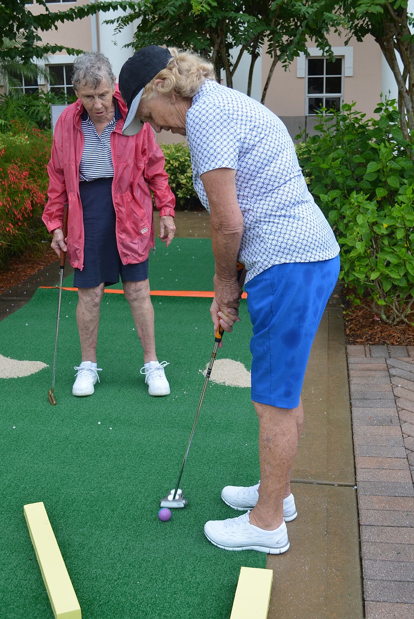 Mary Flynn putts during The Glenridge Mini-Golf Tournament.
