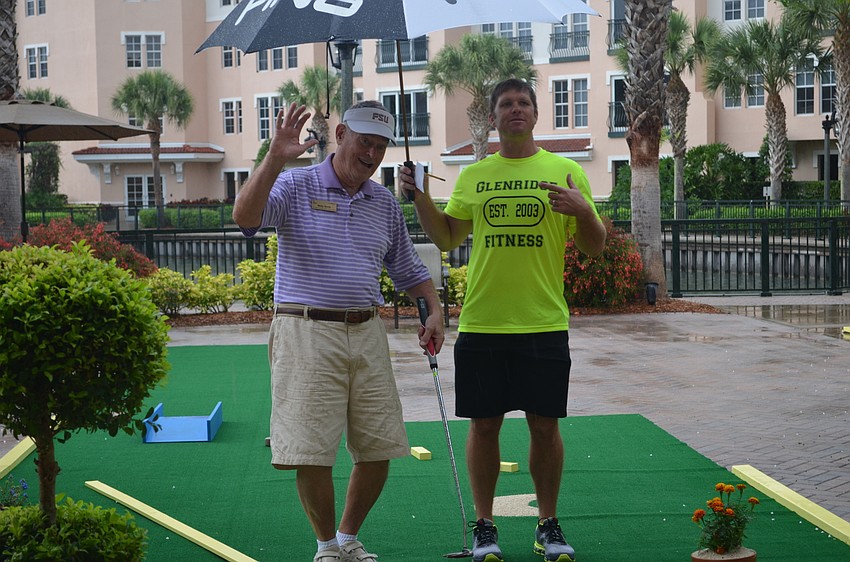 Dr. Wally Smith was determined to finish the course even if it required playing through the rain. He finished 8 under par.