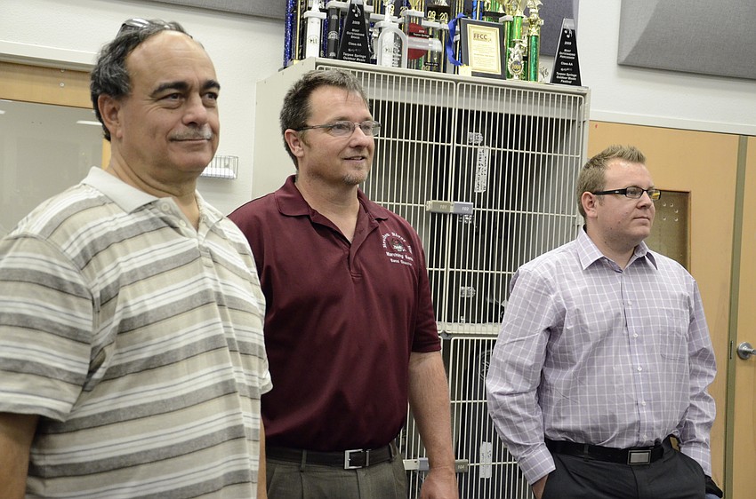 William Barbanera, Sarasota Concert Band music director, Kendall Carrier, Braden River High School band director, and Michael Walker with the Fiati Five watch a master class session.