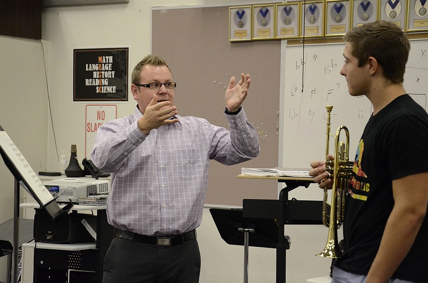 Michael Walker, Assistant Professor of Horn at the University of New Mexico, instruct Blake Bennett, Pine View School senior, how to use his breathing more efficiently.