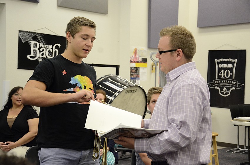 Blake Bennett and Michael Walker discuss a music selection to work on.