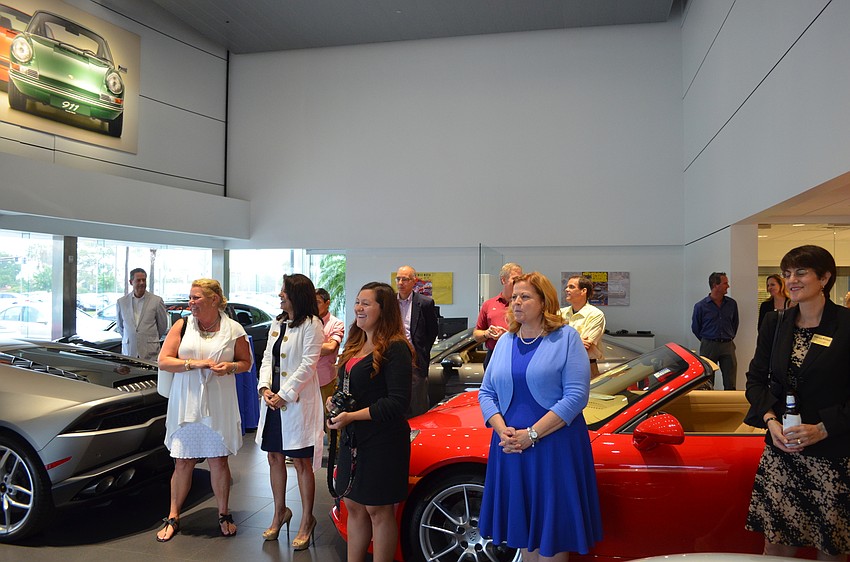 Guests gathered in the showroom for Suncoast Porsche.