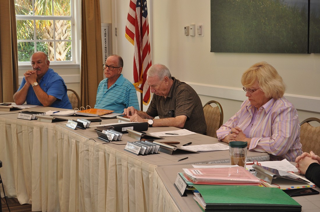 Members of the Inter-District Authority Board vote on their 2015-2016 budget.