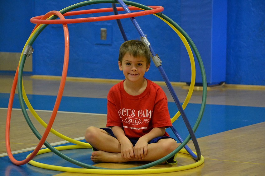 Johnny Cavoli builds a fort with hula hoops.