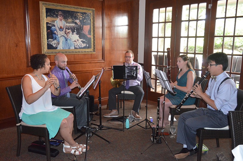 Flutist Alica Jones, oboist Zach Pulse, hornist Mike Walker, bassoonist Christina Dioguardi and clarinetist David Cook