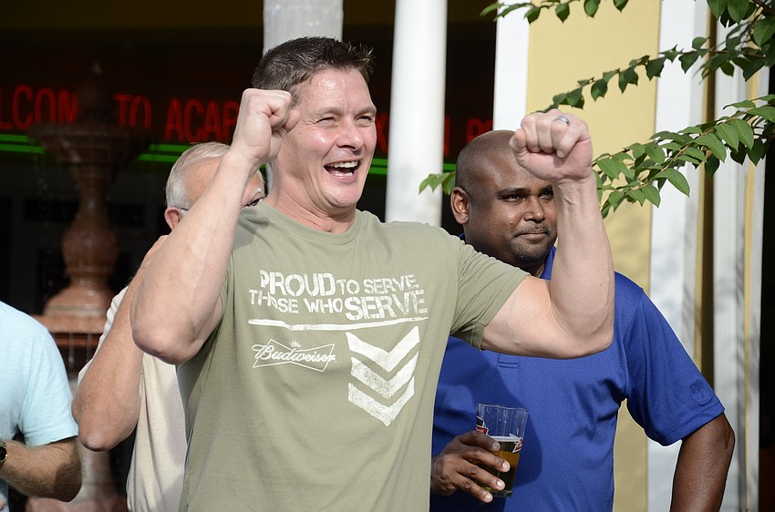 John Breiner cheers on the competitors during the final seconds of the 8-minute competition.