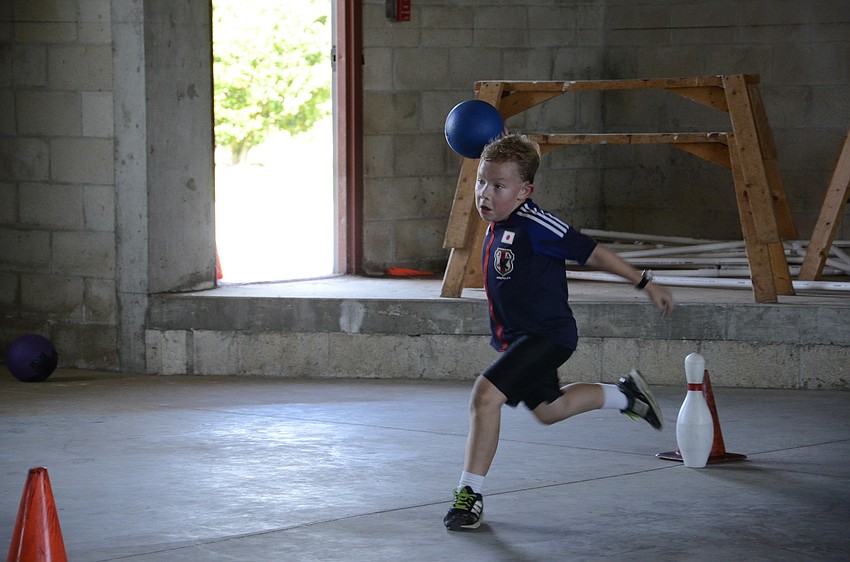 Drew Witte tries to knock over a pin in 