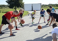 Kids practice ball handling during the morning basketball session.