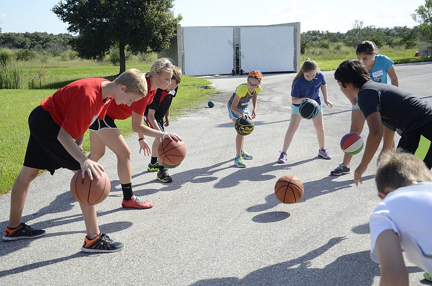 Kids practice ball handling during the morning basketball session.