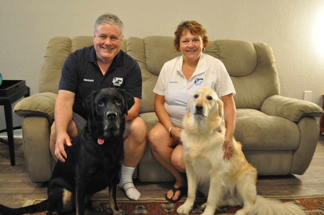 Don Olinger and Tracy Rhodes moved into their two-bedroom apartment in May with dogs Ralphie and Gary.