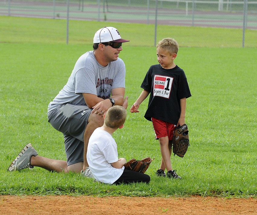 Braden River baseball coach Craig Page spent time providing his campers with individual instruction.