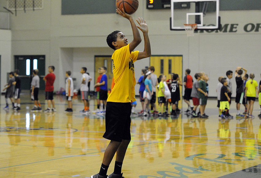 Nolan Middle School eighth-grader Keon Buckley scores a basket during a game of hotshot.