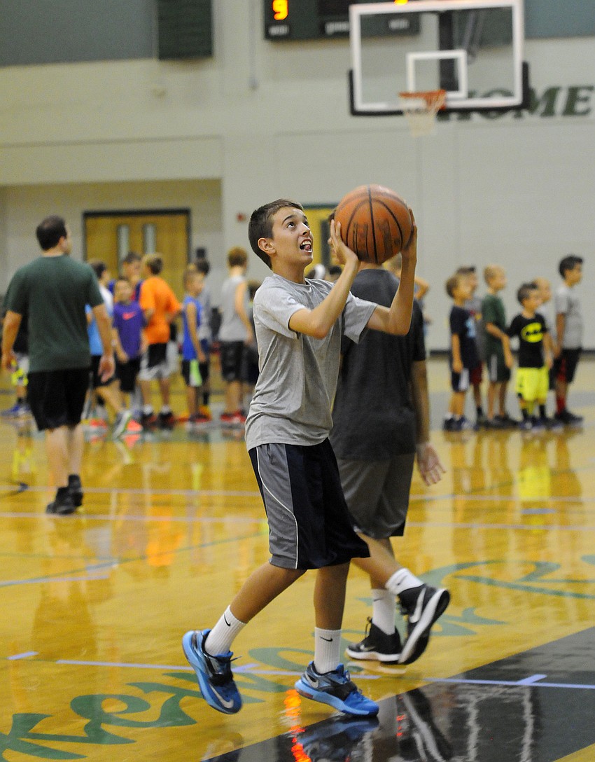 Camden Sprague attempts to beat his opponent to the hoop during a game of hotshot.