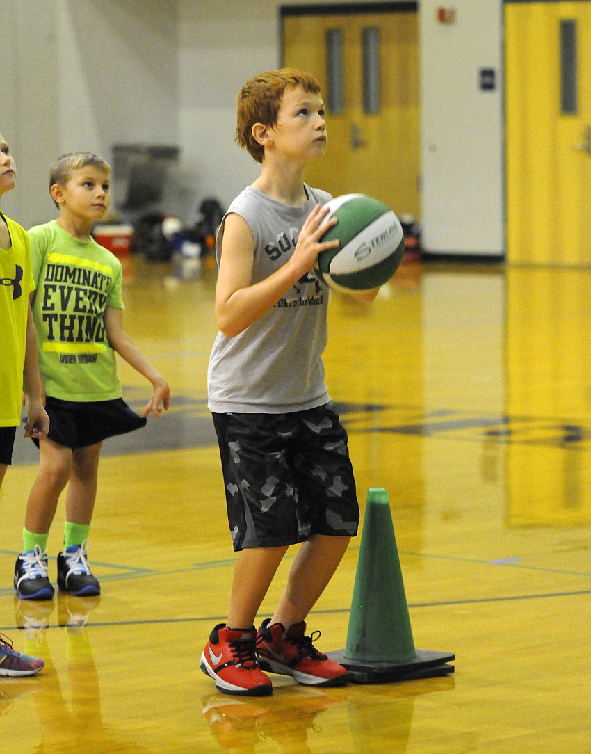 Gage Sanders participates in a series of shooting drills during the final week of camp.