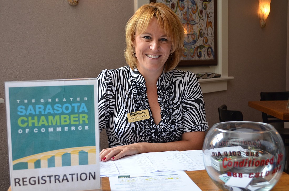 Jamie Overmiller greets guest at the Greater Sarasota Chamber of Commerce Power Hour Luncheon.