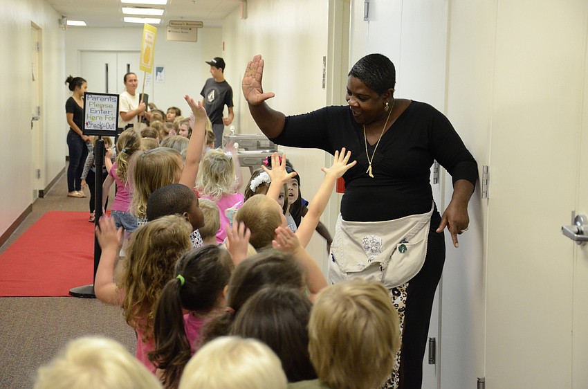 Pamela Patterson, a Little Lambs teacher, asked the children if they liked ice cream, and gave high fives.