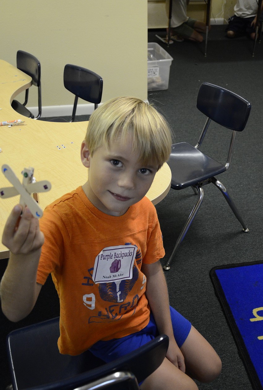 Noah McAfee shows off his dragonfly.