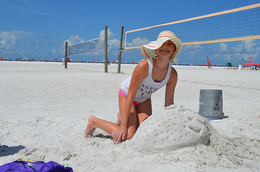 Kara Klemeyer works on her strawberry sculpture.