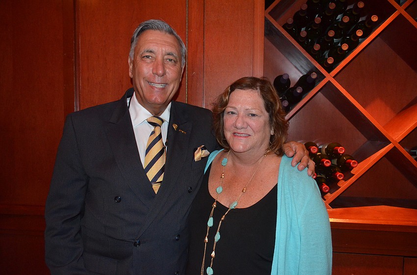 Andrew Vac, of RE/MAX, and Debbie Allen, of Fleming’s