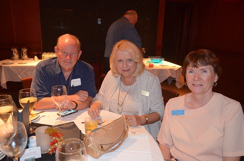 Ron Fuller, of Surf Shack, Shirley Dabringhaus, of Sunset Realty, and Nancy Taussig, of Barefoot Weddings
