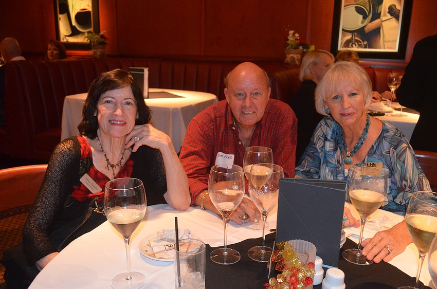 Mary Vaughn, of Sunset Realty, and Tom Pluto, of Bright Realty, and Peg Pluto, of Tommy Bahama