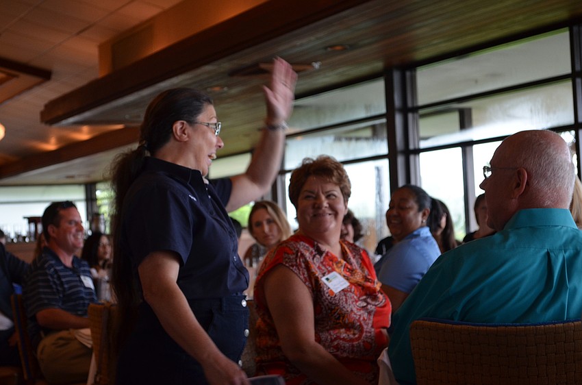 Debbie Shaffer of Henson Mechanical greets fellow members.